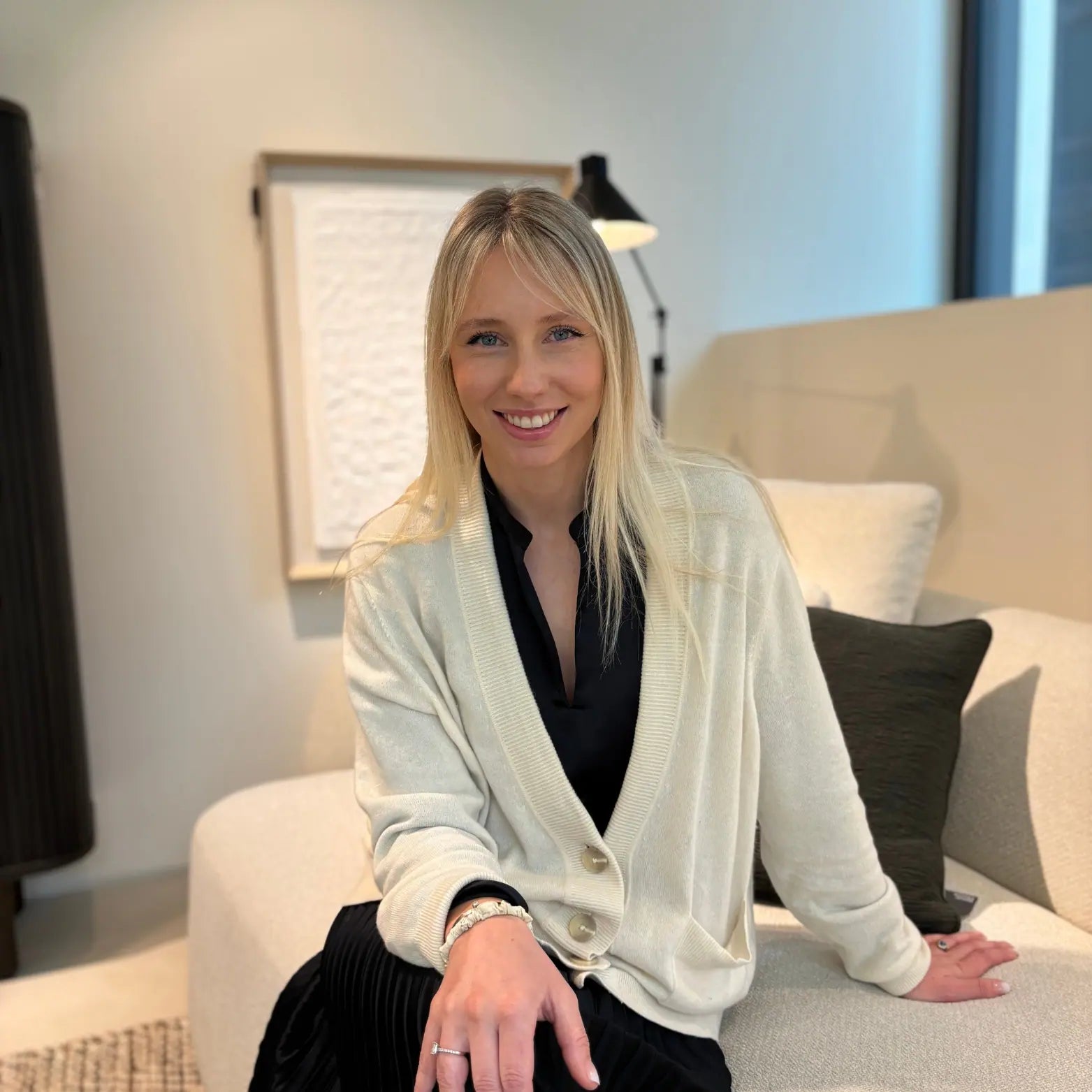 founder formed & Furnished, interior designer sitting in a modern interior space