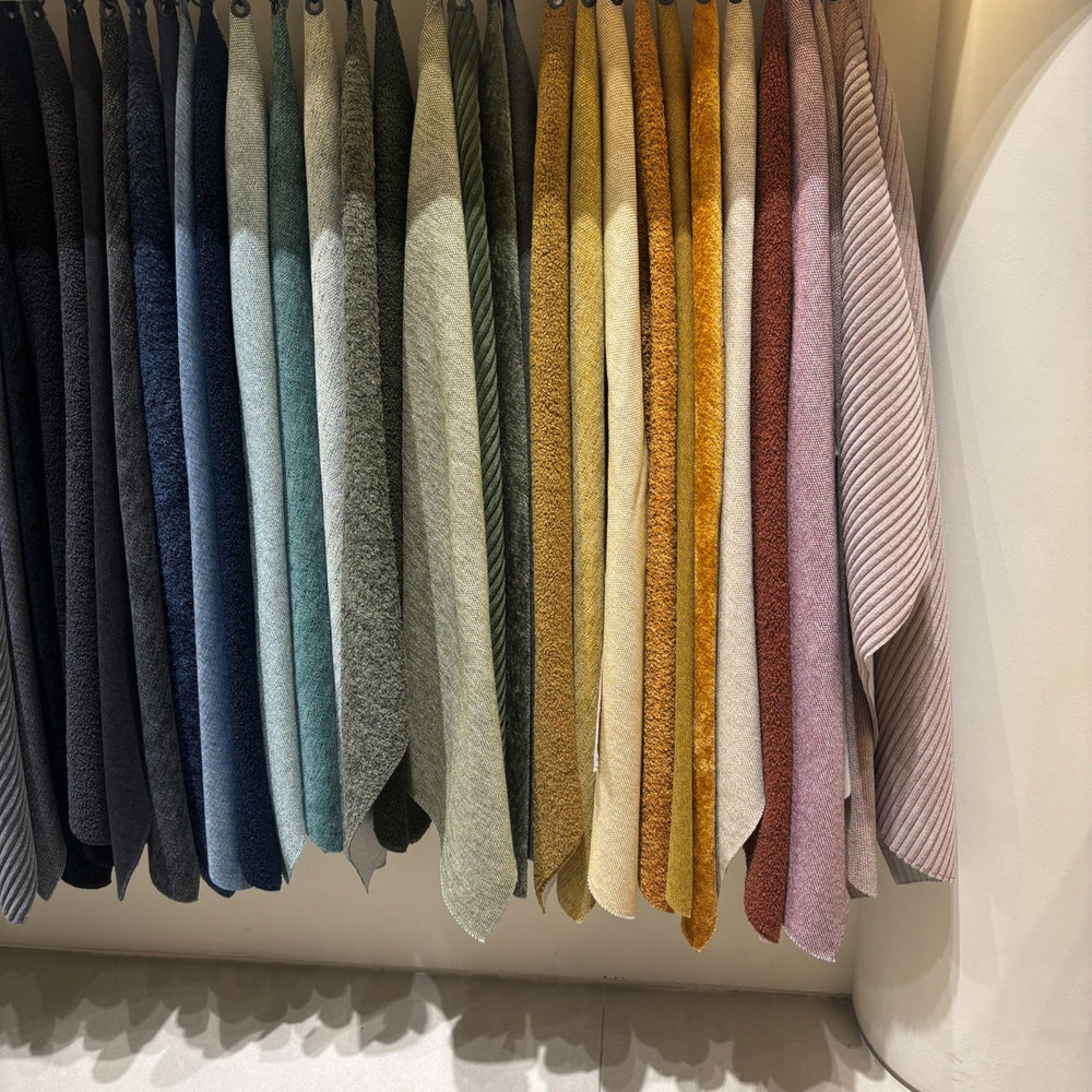 Organized fabric samples for a colourful Scandinavian inspired interior styling.