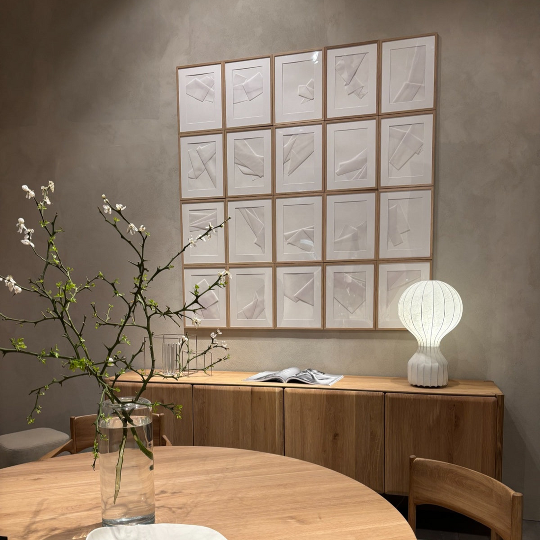 Minimalist Scandinavian inspired dining setup with light wood furniture and soft decor