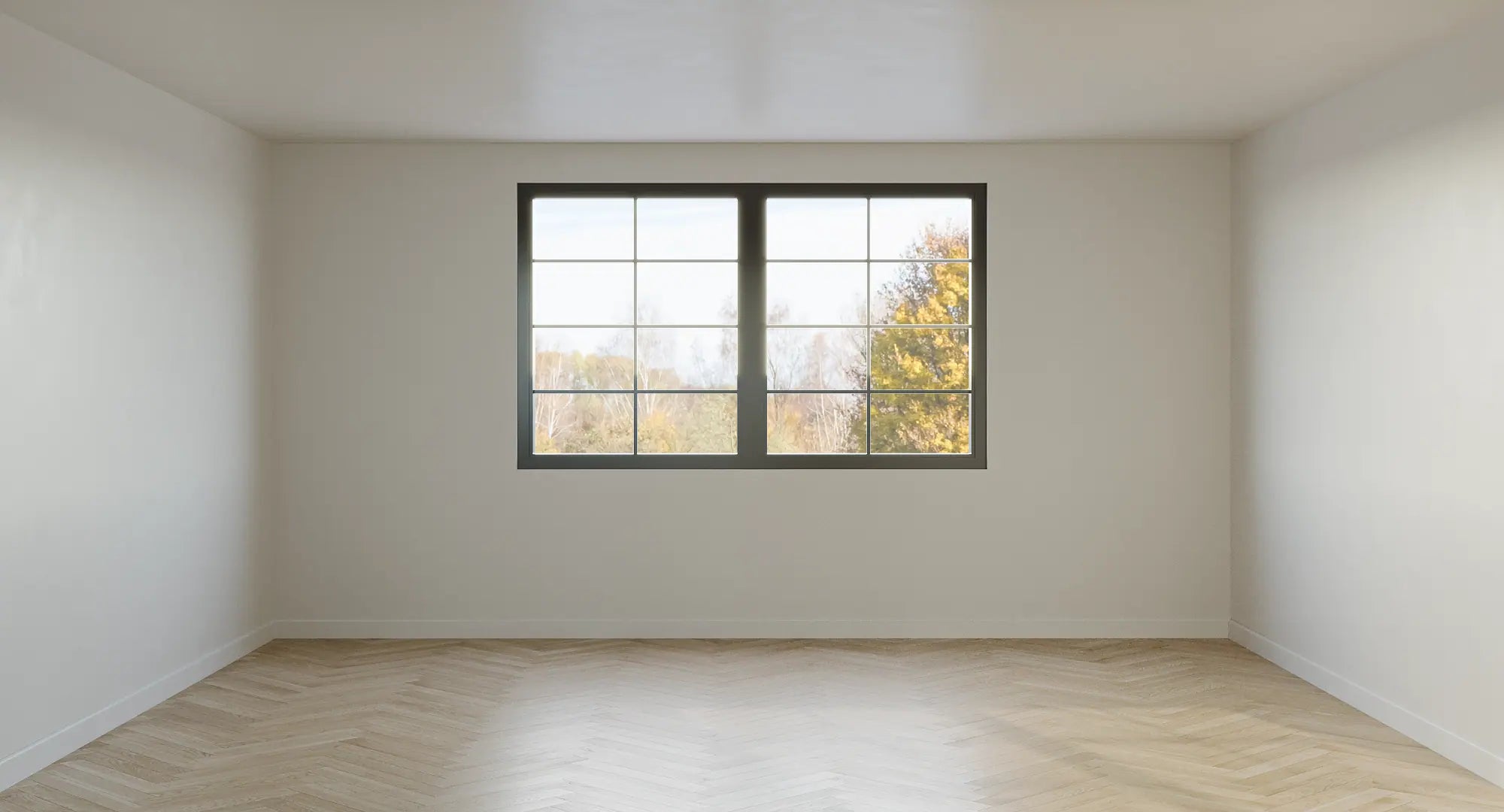 Before image of a 20 sqm room, herring bone flooring and white walls.