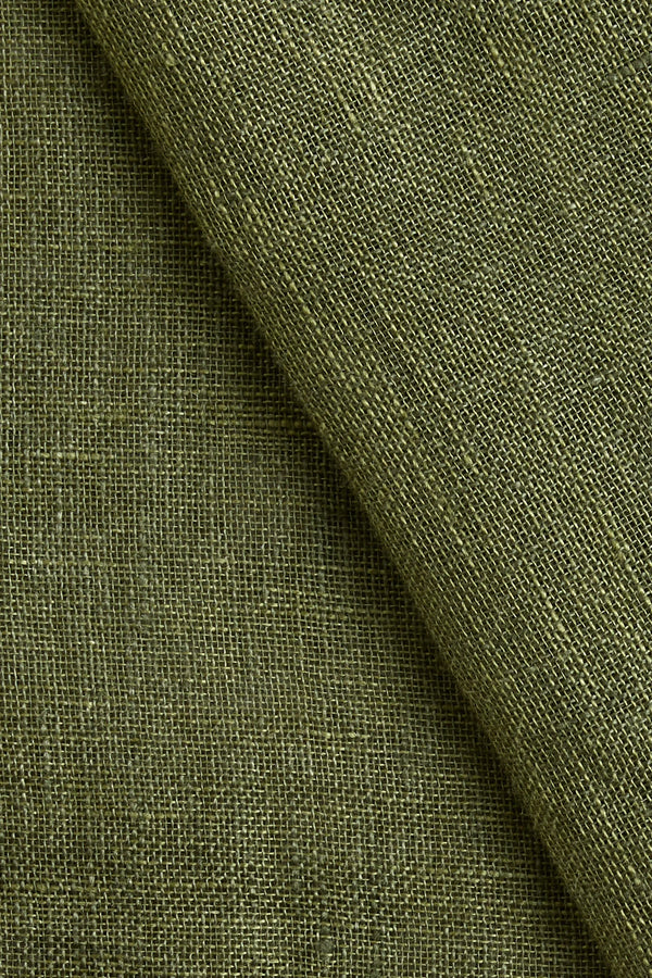 Close-up of olive green linen curtain fabric texture – included in The Ro living room furniture package by Formed & Furnished