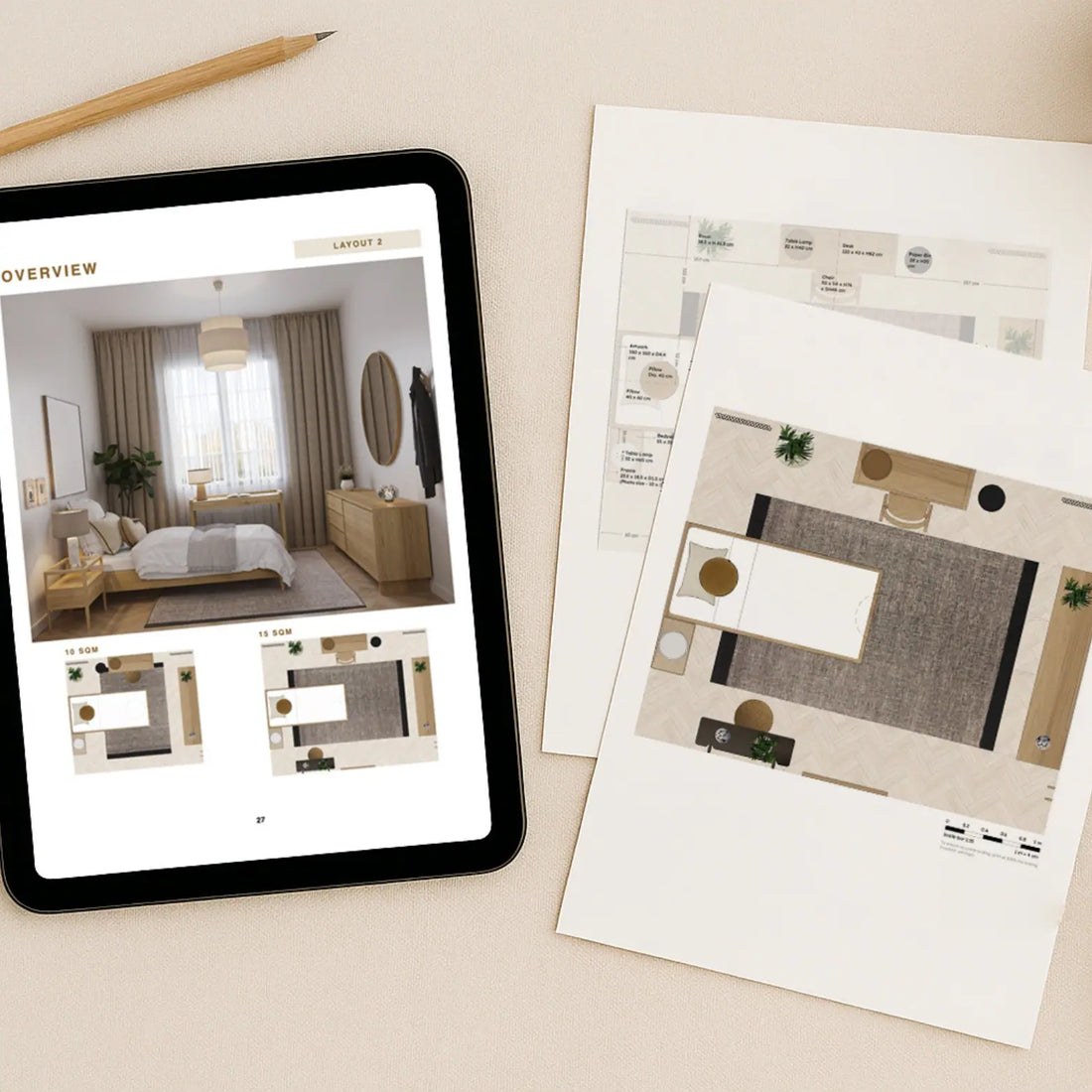 Tablet displaying interior design software on a desk with printed layout plans.