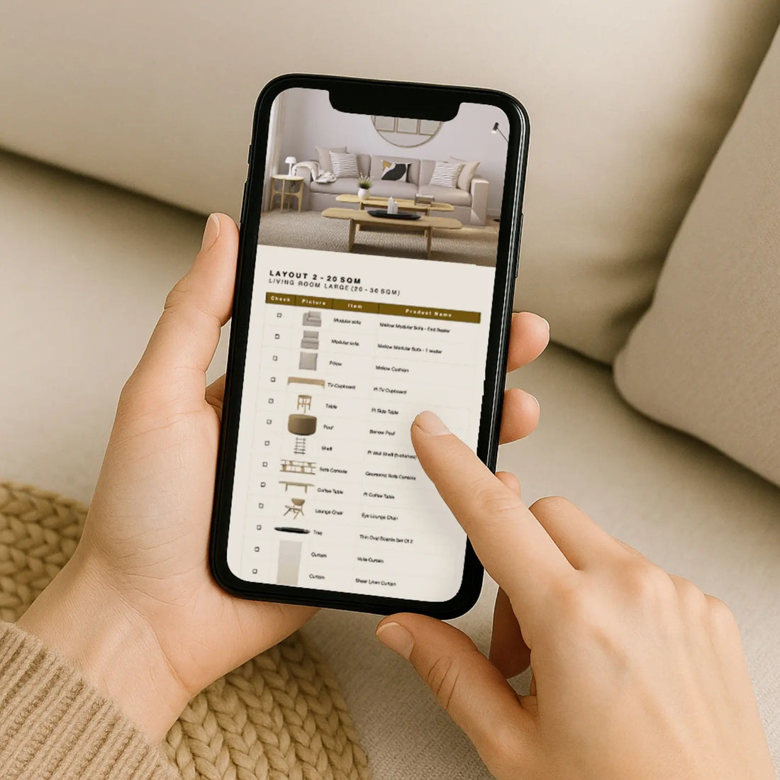 Person using a smartphone app to design a room layout with furniture options.