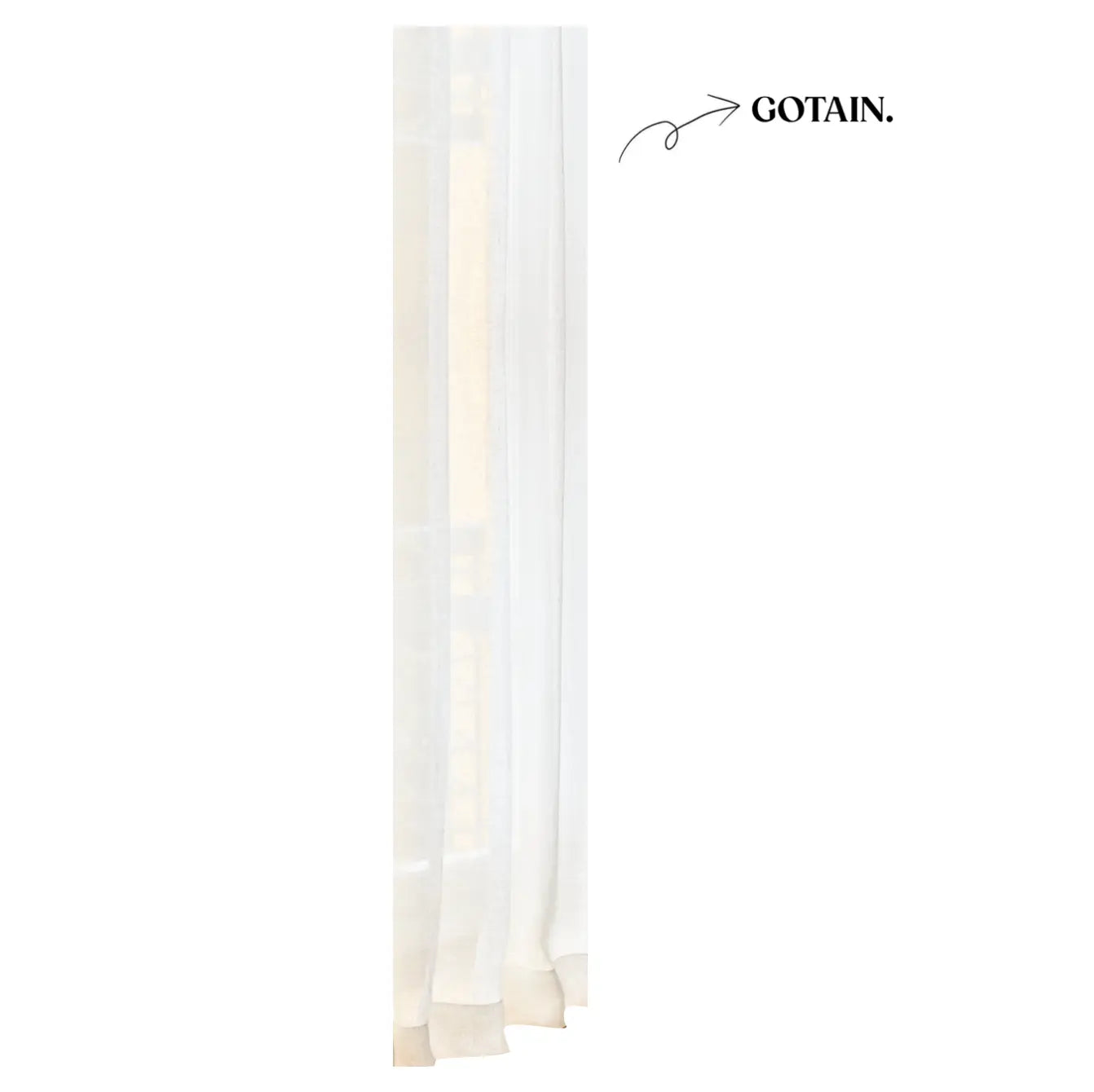 Elegant white linen curtains used in cozy, Scandi-inspired room styling.